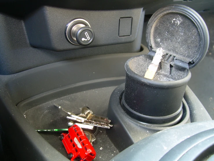 car keys sit on top of the center console of a car