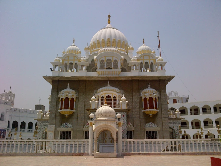 an ornate building with a clock on the top