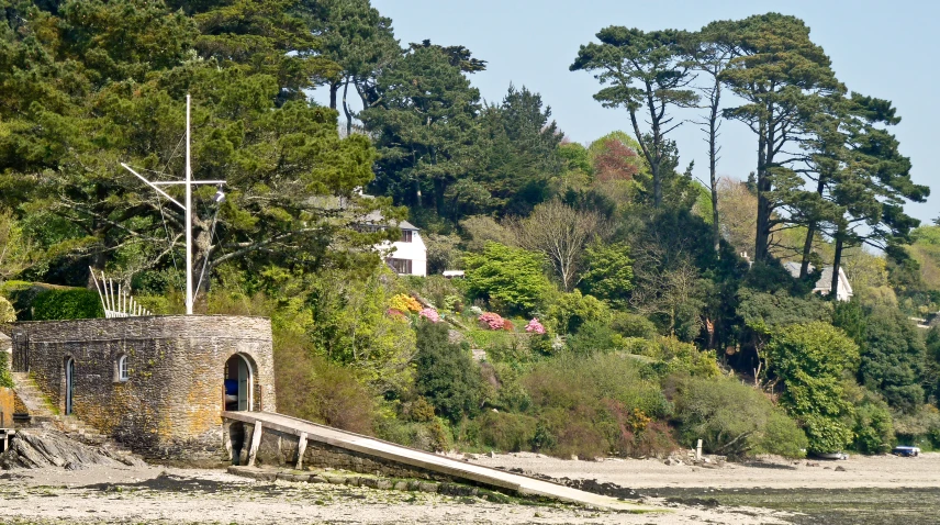 an old cemetery sits on the shore of a bay