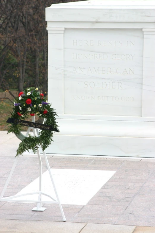 a wreath is laying at the base of a monument