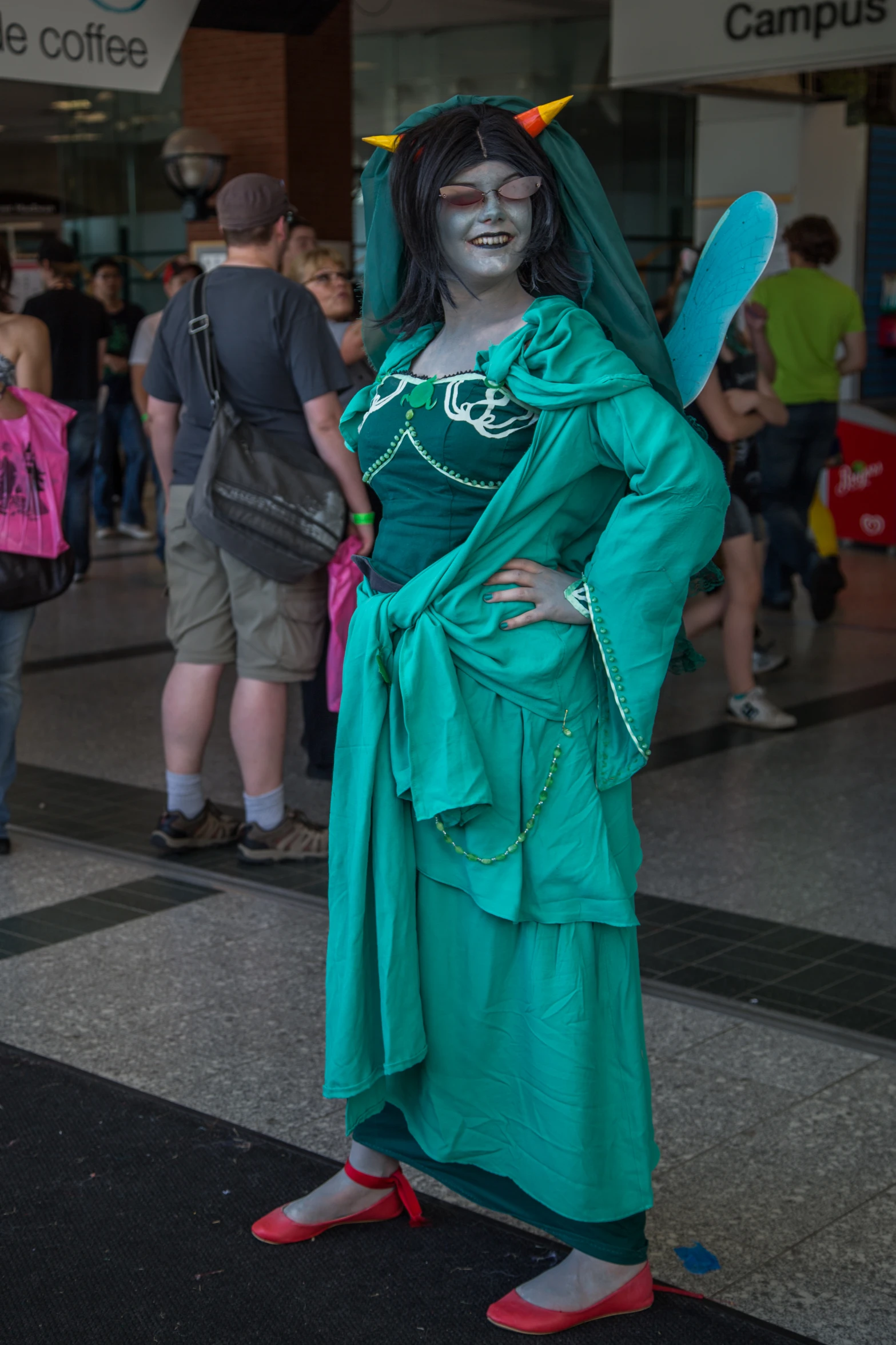 a man dressed as a fairy costume and posing for a po