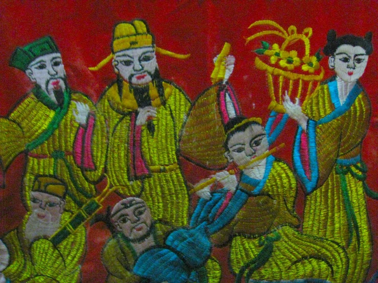 this painting depicts an oriental family playing instruments together