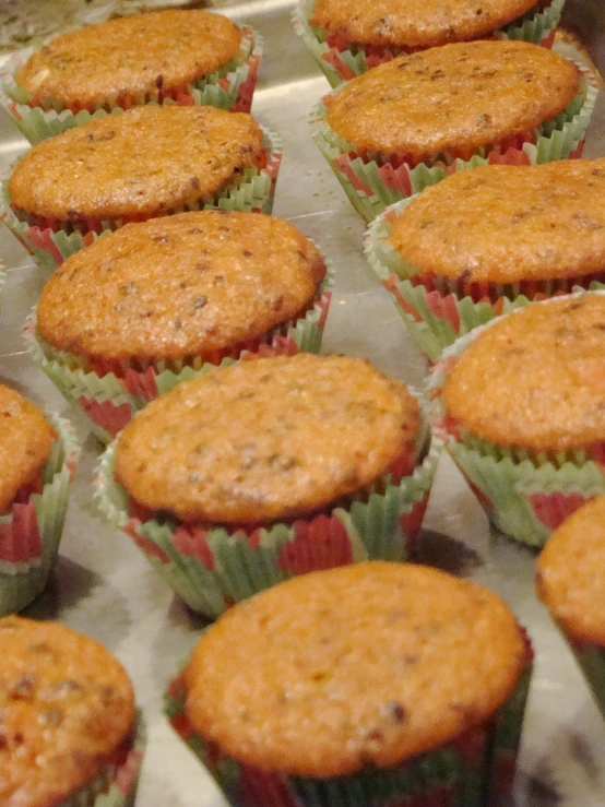 muffins lined up on a baking sheet