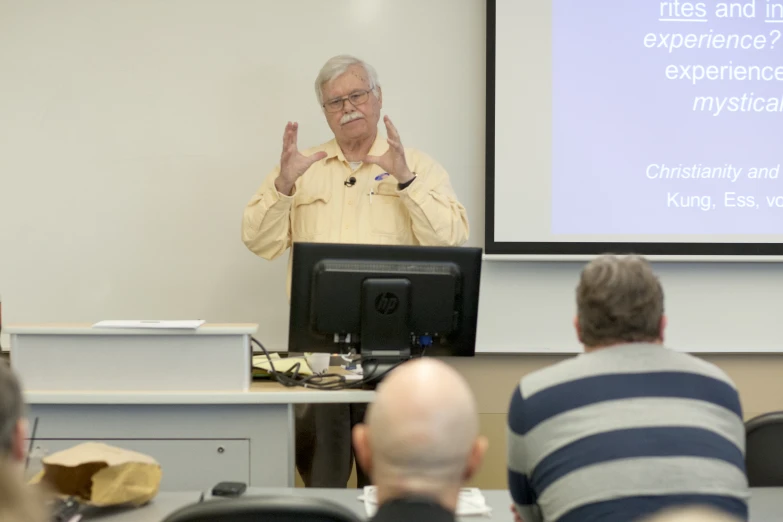 a man giving a lecture to the audience