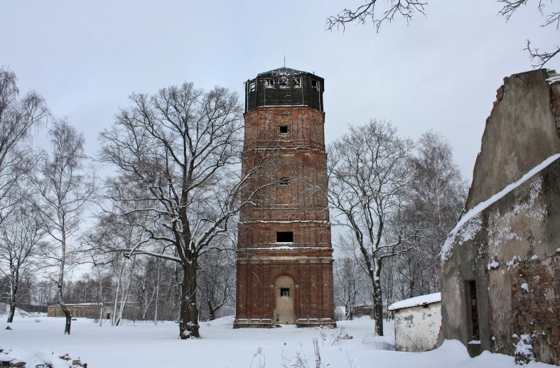 there is a large brick tower in the snow