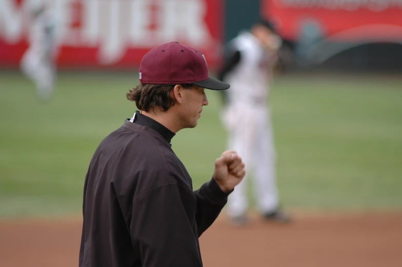 two people are playing on the baseball field