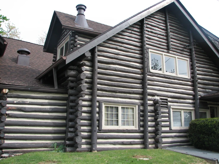 the front view of a log cabin