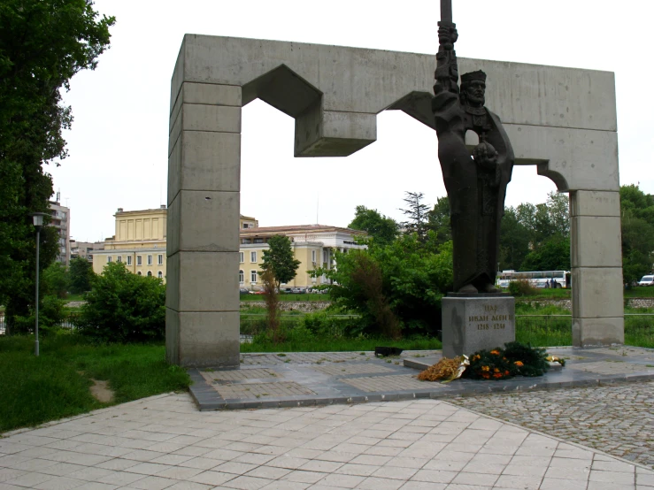 a statue in the shape of a man holding a rifle