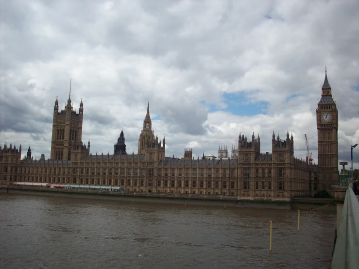 the large building has a very big clock on it