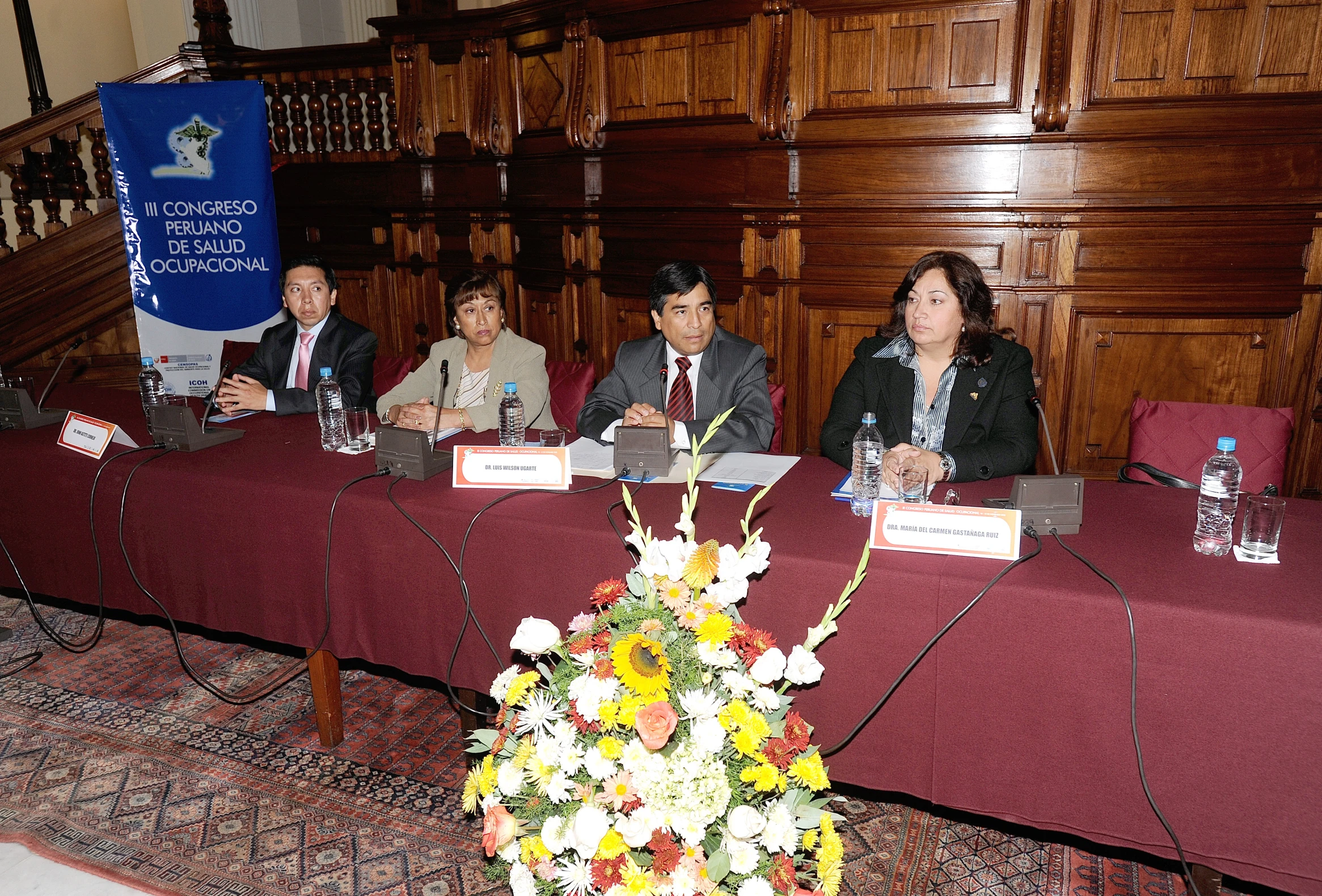 a group of people sitting around a conference table