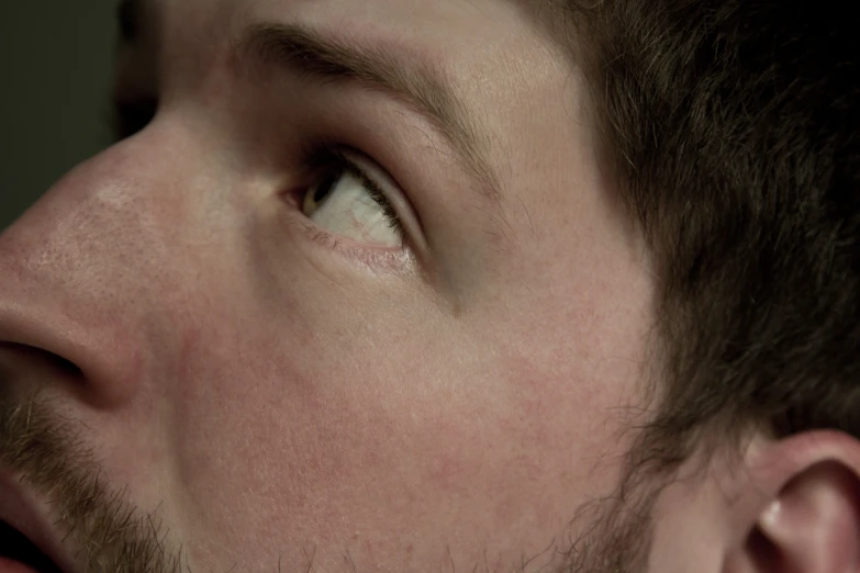 an close up of a man with a tie on