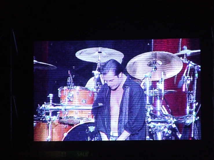 an image of a drummer on a tv screen