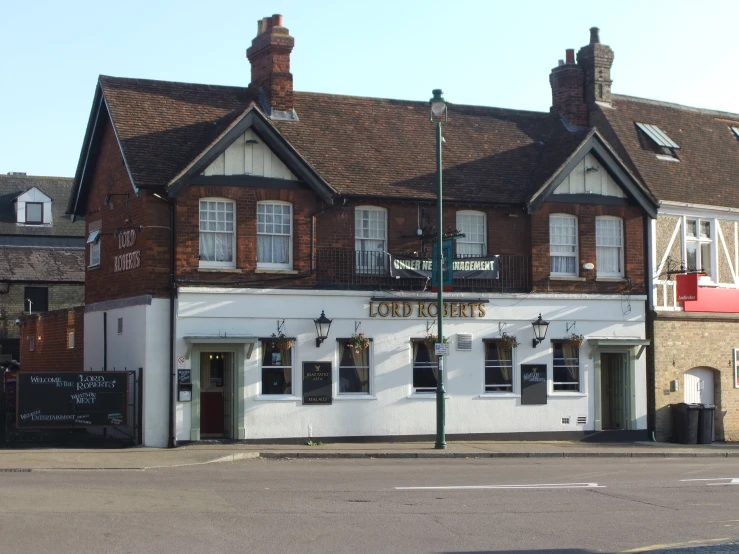 the corner shop is white with black trim and windows