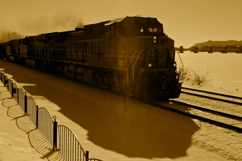 a train is moving on the tracks through the snow