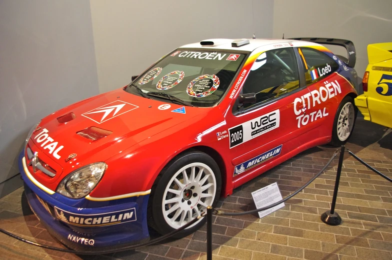 a car parked on display in a museum