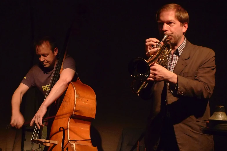 a man playing the trumpet at a concert