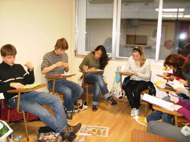 a group of people sitting in front of a window