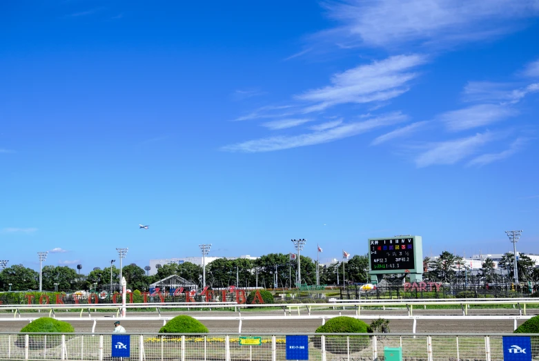 a jockeys stadium sitting in the middle of a large field