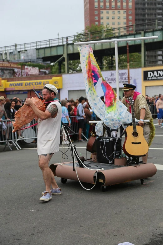 a man is dancing with a balloon on a float