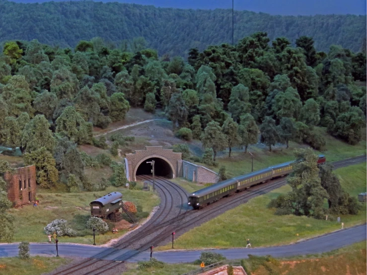 a view of a train coming out of a tunnel