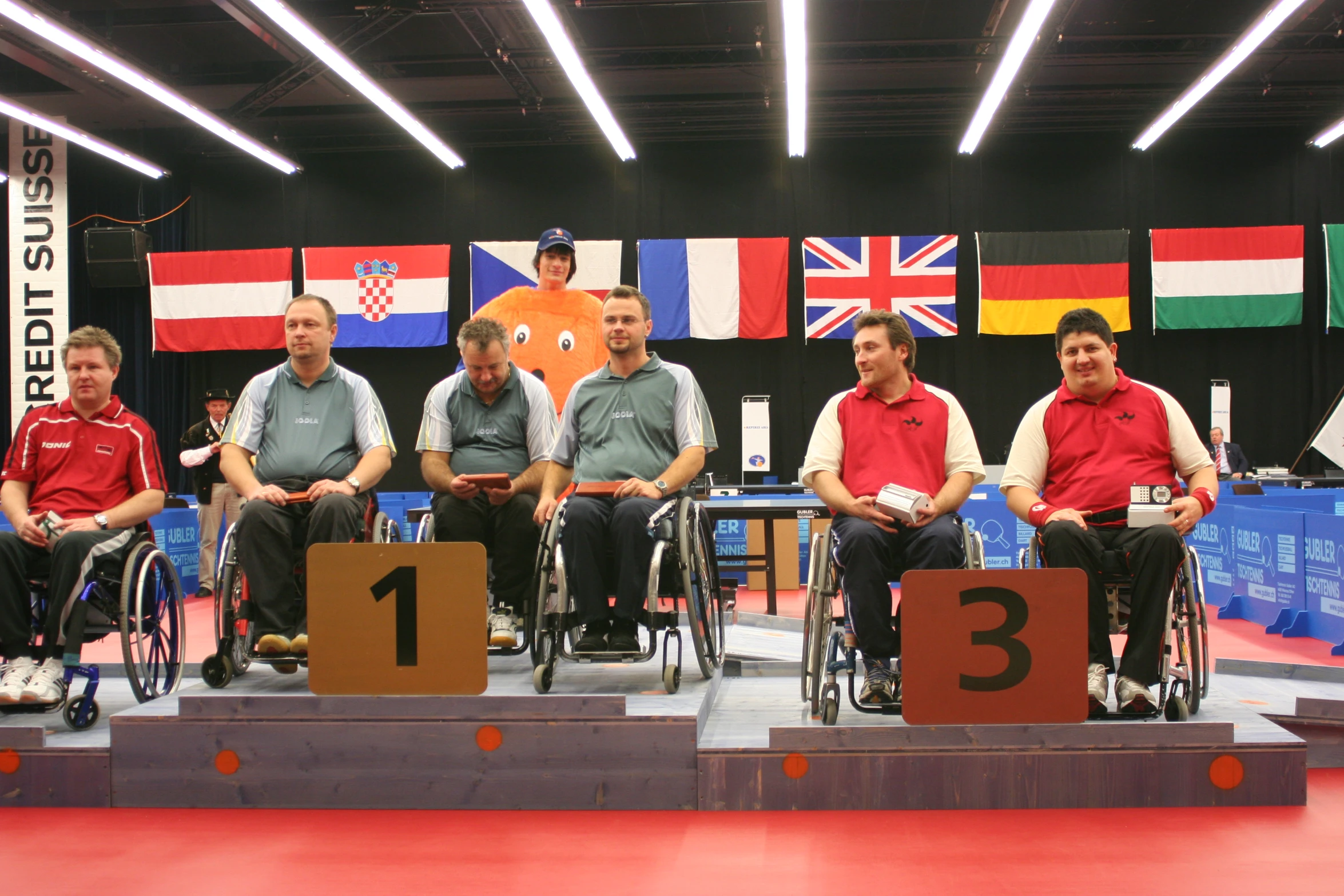 a few men on wheelchairs stand for a group po