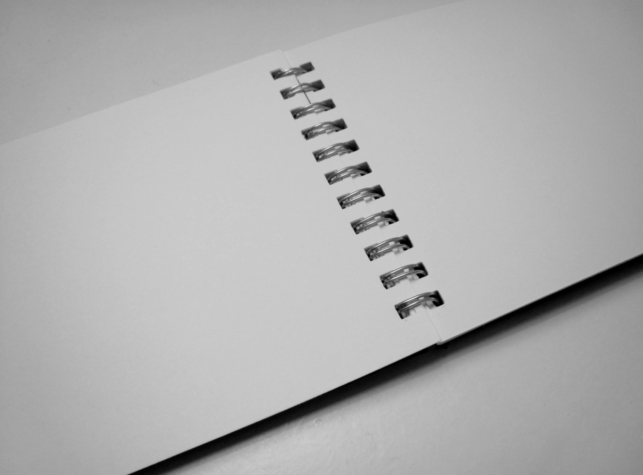 a black and white po of a spiral note book