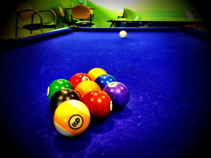 a pool table with colorful billards on top