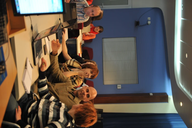 people sitting in a classroom waiting to receive lecture