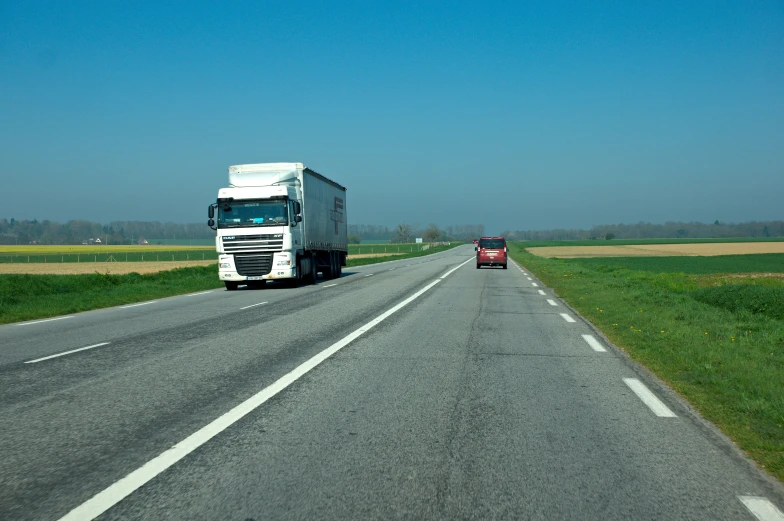 there is a large truck that is on the road