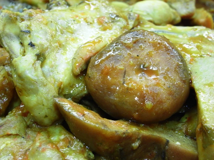 an assortment of cooked food being displayed on the plate