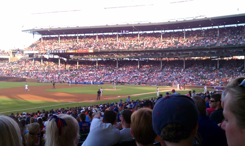 a baseball field with many spectators