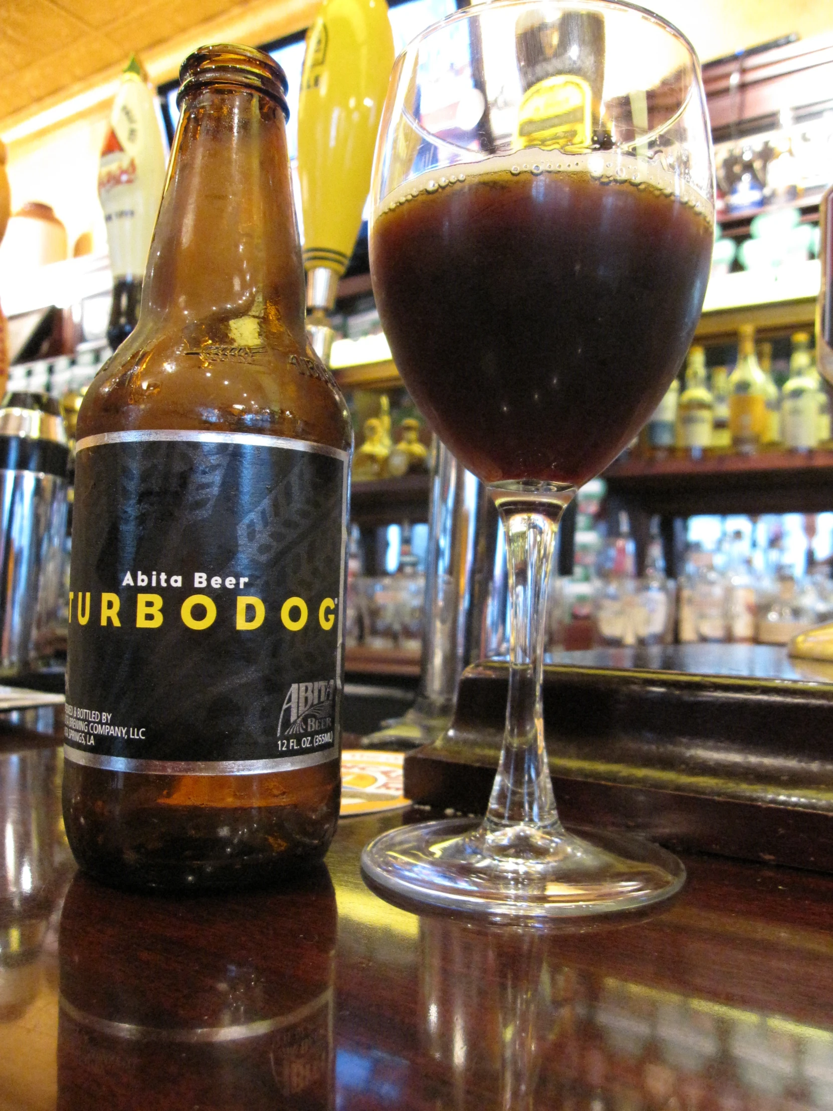 a bottle of beer sitting on top of a table