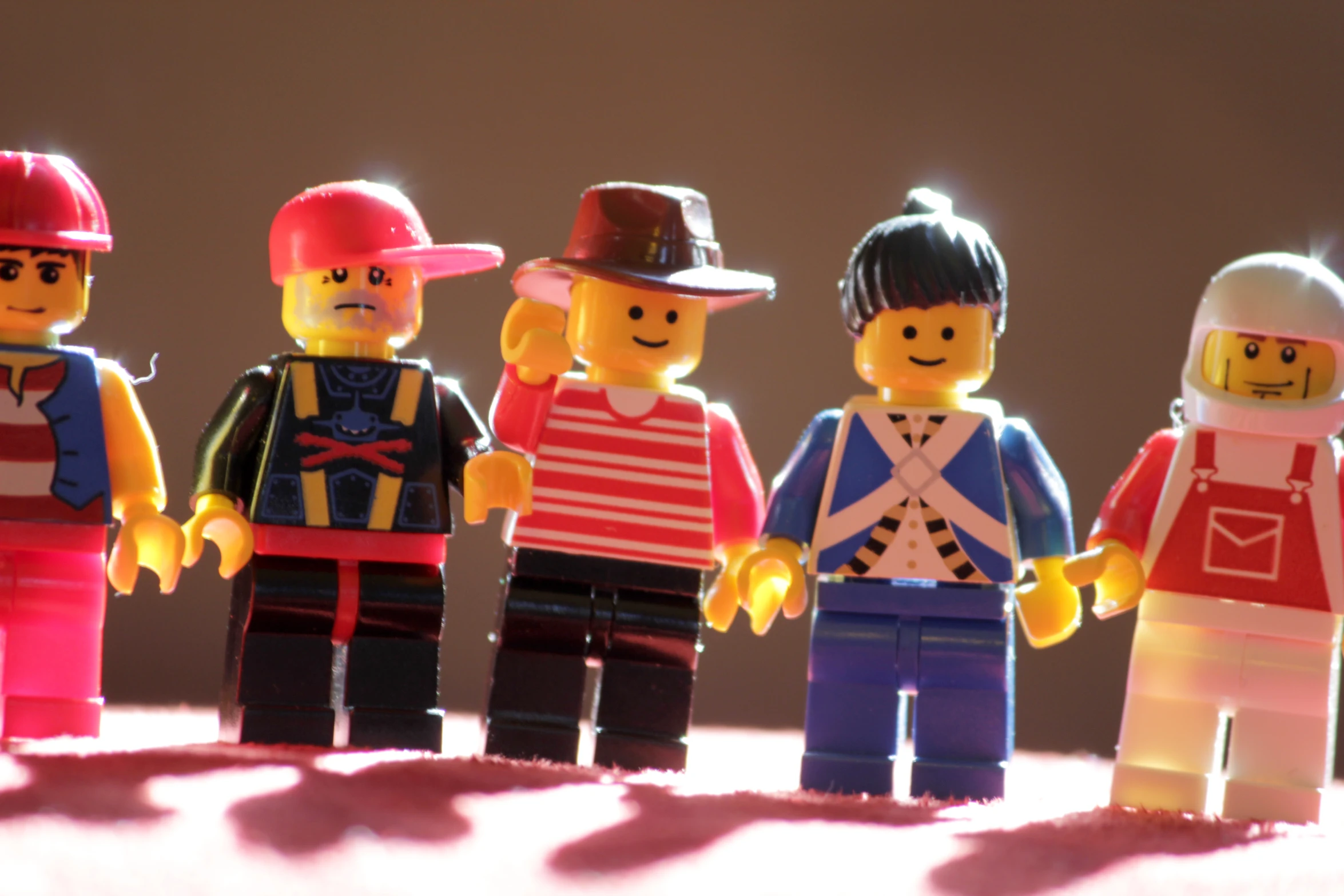 a group of small legos standing in line