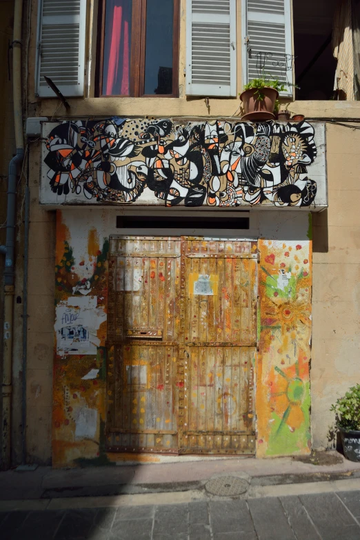 a old door with shutters in front of an abandoned house