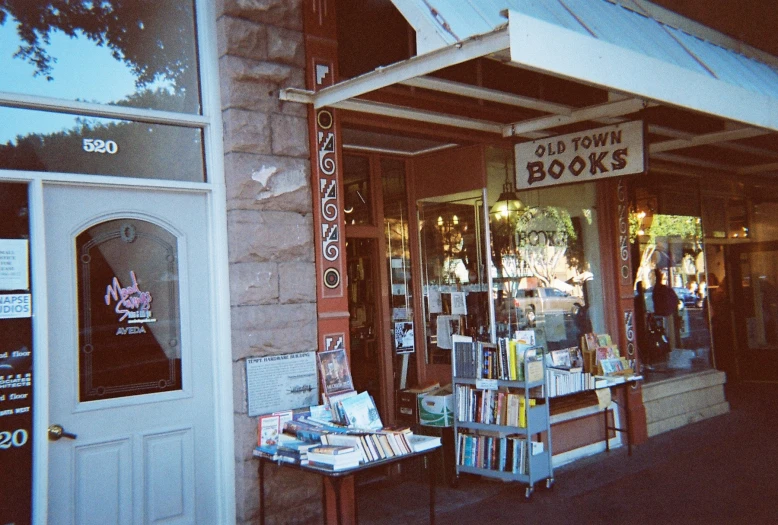 a shop with a small book sale outside of it