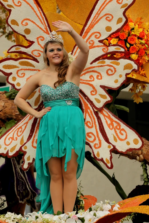 a woman standing in a costume made to look like an angel