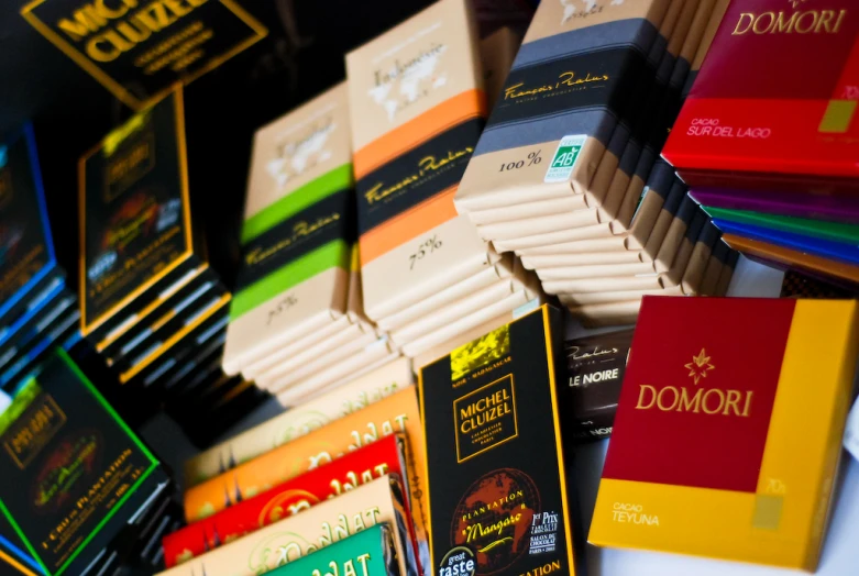 several stacks of colorful cigarettes sit side by side