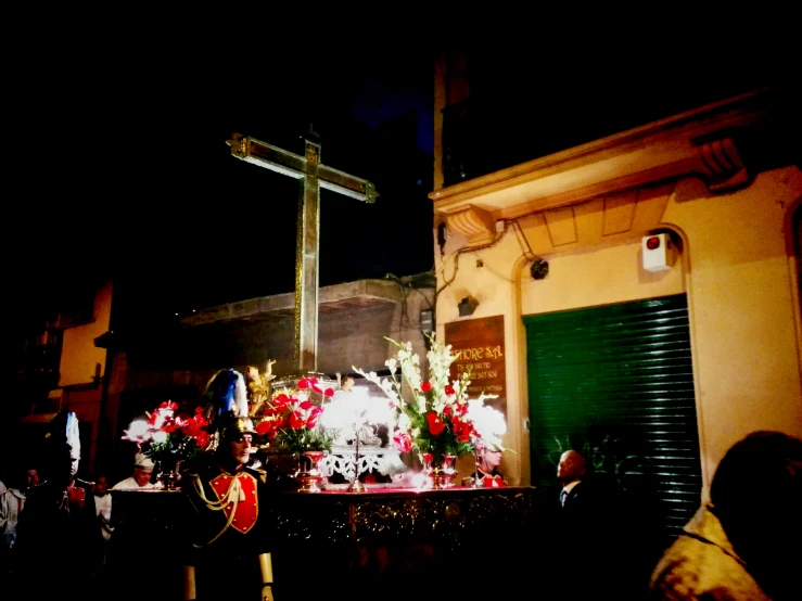 people at night next to a street light