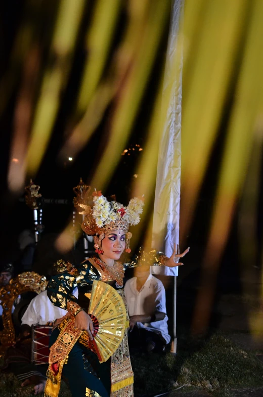 an image of a woman with fancy headwear