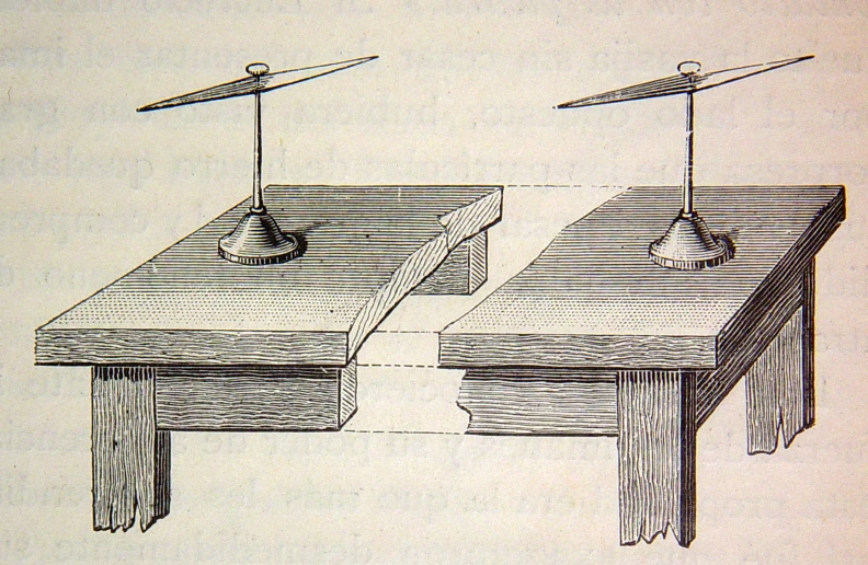 a drawing of two desks in the style of early computers