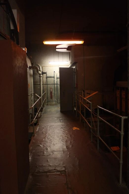 a dark room with stairs leading into the bat