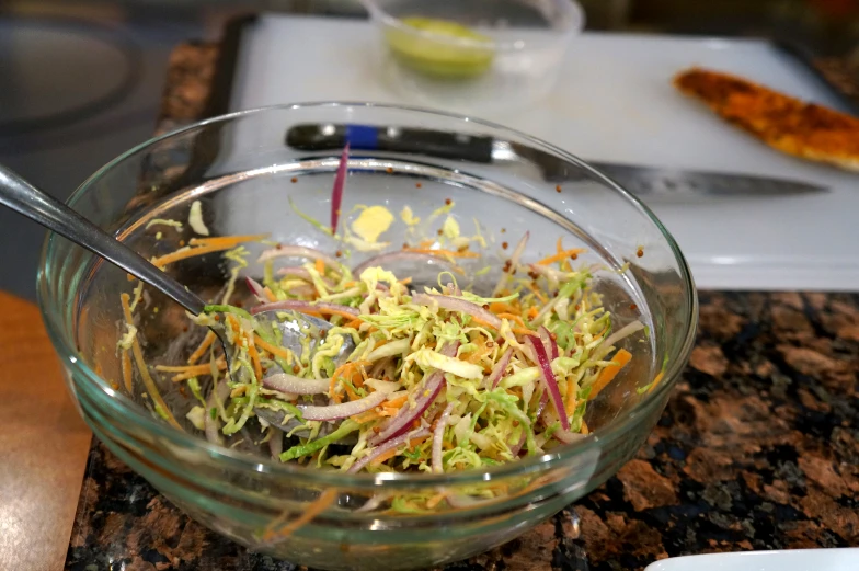 a salad in a bowl is ready to be eaten