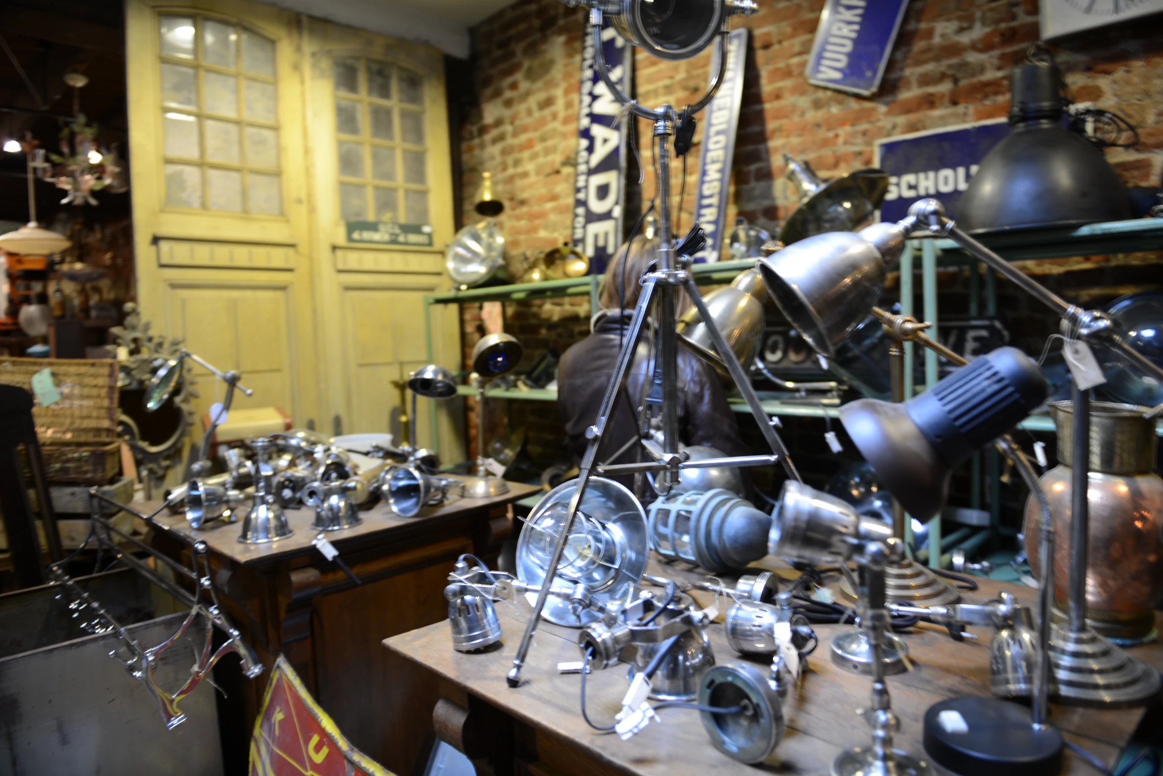 some type of metal decoration and various clocks on display