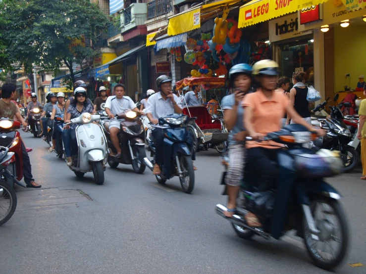 a large group of people on motor bikes