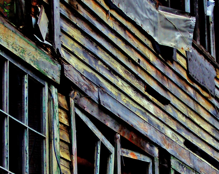 an old building with several windows and broken down windows