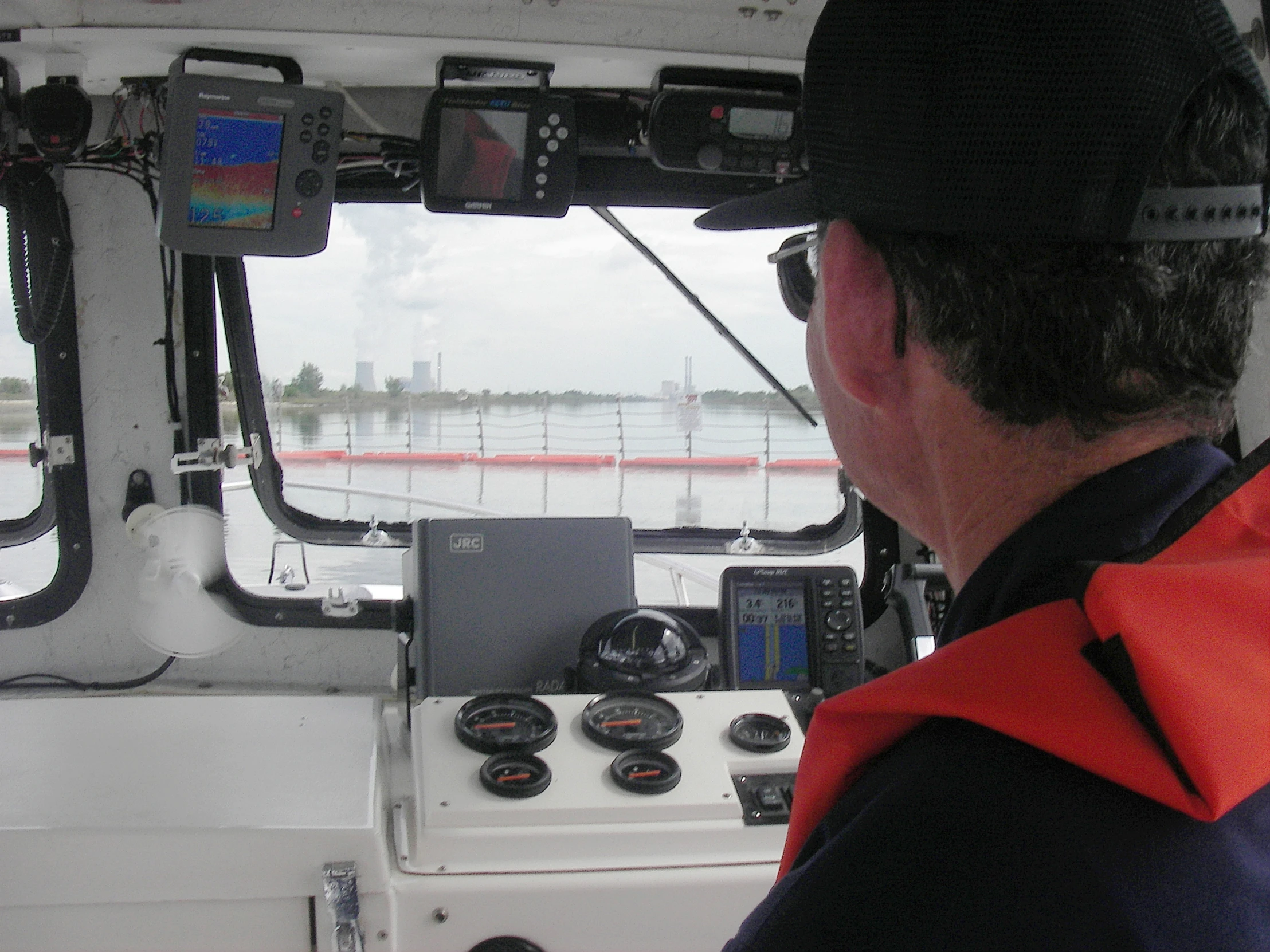 a person inside of a boat, on the water