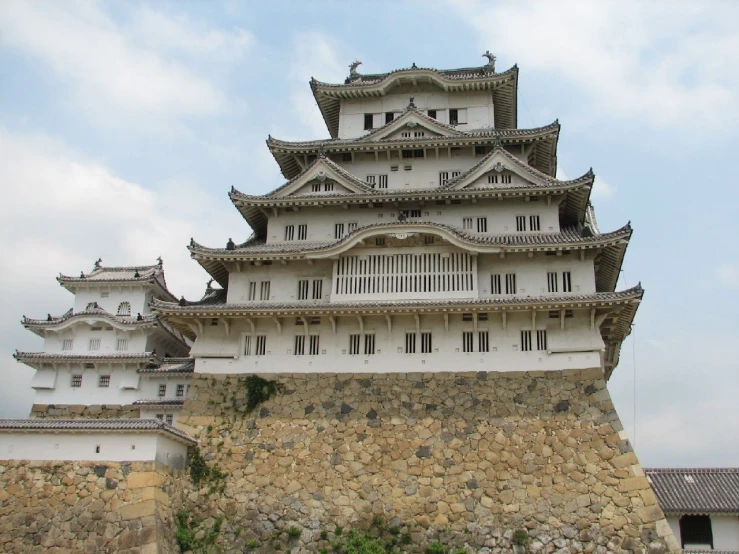 the exterior of a tall, white - painted castle