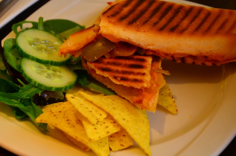 a close up of a plate of food with some veggies