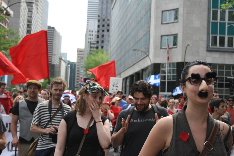 a group of people walking down the street during an event