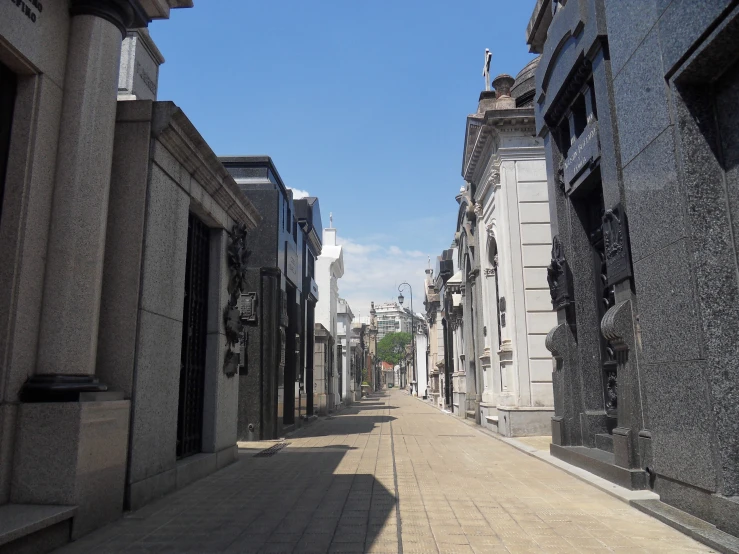 a sidewalk that is next to some buildings